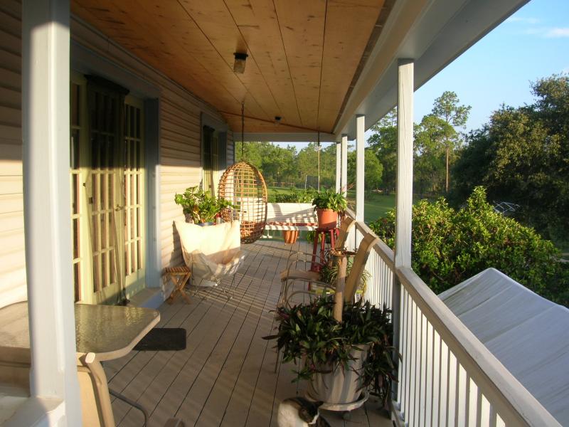 Relax on the back porch to read or enjoy the vews.